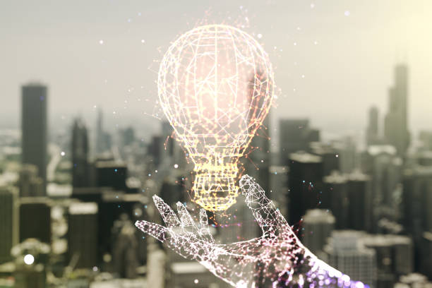 istock Abstract virtual light bulb illustration on blurry skyscrapers background, future technology concept. Multiexposure 1312663140