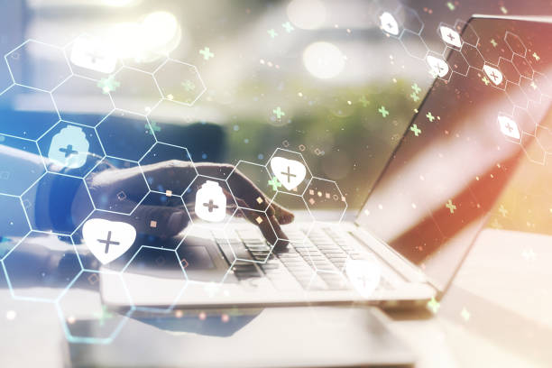 istock Creative abstract medical hologram and hands typing on computer keyboard on background, online medical consulting concept. Multiexposure 1312663153