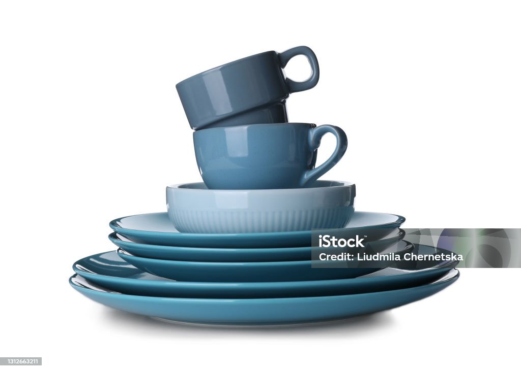Stack of ceramic dishware on white background Plate Stock Photo