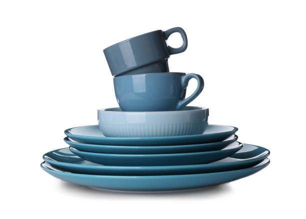 stack of ceramic dishware on white background - blue plate fotos imagens e fotografias de stock