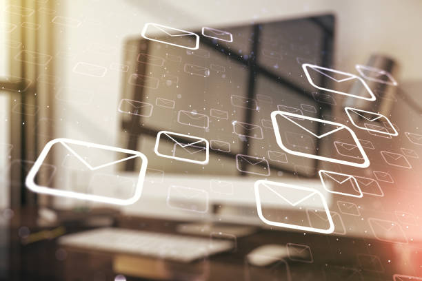 istock Double exposure of postal envelopes hologram on laptop background. Electronic mail and spam concept 1312663232