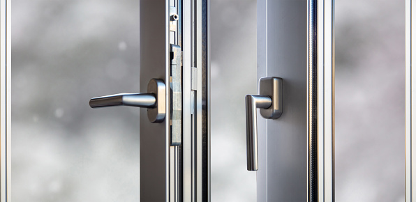 Modern glass and metallic dark front door with chrome handle and digital lock from inside, copy space