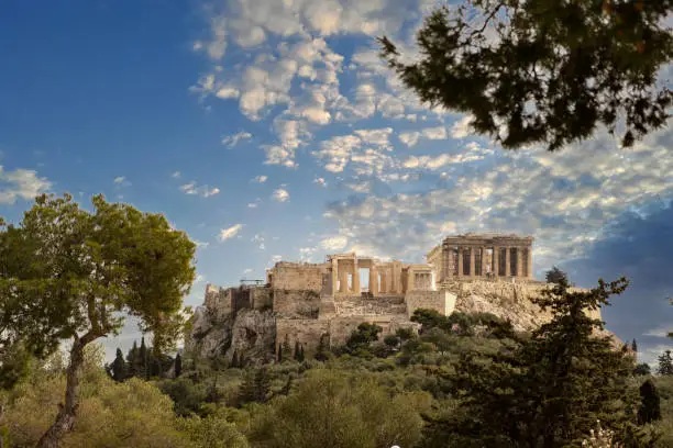 Athens, Greece. Acropolis and Parthenon temple, top landmark. Scenic view of ancient Greece remains from Philopappos Hill, blue cloudy sky background.