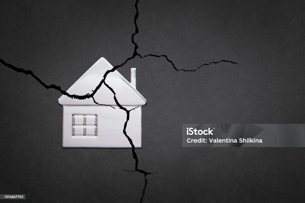 A broken house. The division of the property. The destruction of the family. A broken house. Divorce and division of property. A symbol of family problems. Family Stock Photo