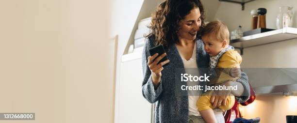 Woman On Maternity Leave Spending Time With Her Baby Stock Photo - Download Image Now