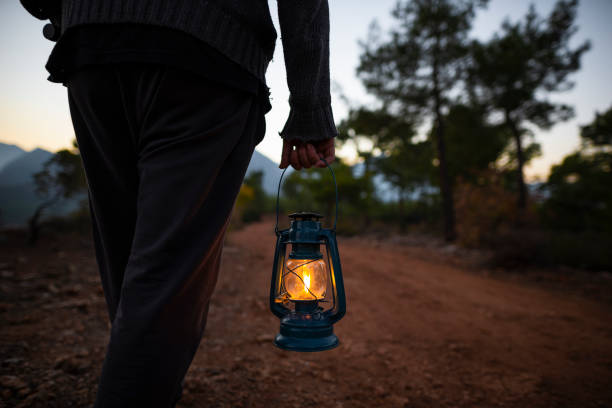 istock stroll through the woods with a kerosene lamp. 1312668015