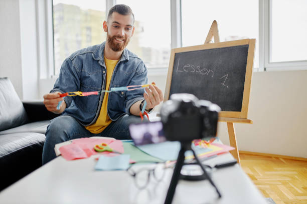 istock Man recording educational video for his vlog on camera 1312671300
