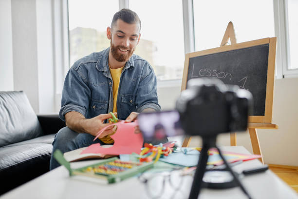 istock Man recording educational video for his vlog on camera 1312671514