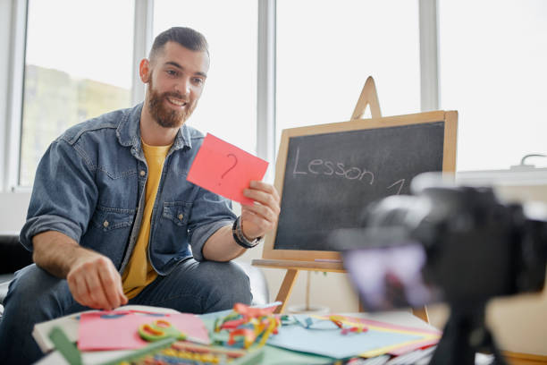 istock Man recording educational video for his vlog on camera 1312671675