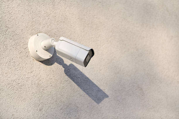 istock IP CCTV security camera on concrete wall, urban cityscape 1312671703