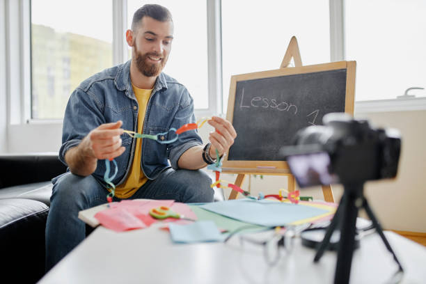 istock Man recording educational video for his vlog on camera 1312672001