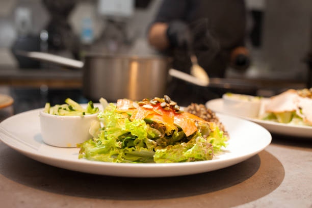 istock Salad with lettuce and salmon in the restaurant kitchen 1312673981