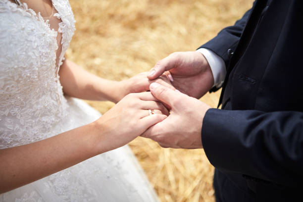 istock Bride and groom holding hands outdoors,  wedding theme 1312674023