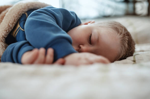 istock An adorable two years baby boy taking a nap 1312674456