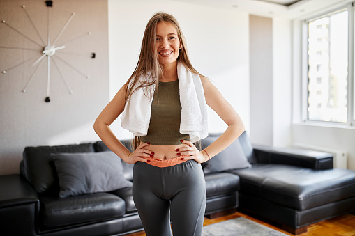 Young woman doing home workout in living room