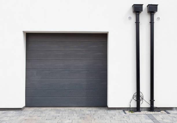 istock Modern new garage door (sectional door) Roll shutter door. 1312676303