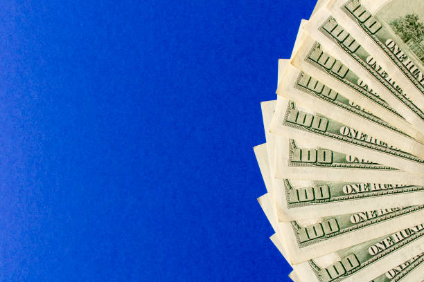 istock Abstract background of hundred-dollar bills. Selective focus. 1312677232