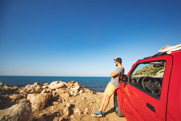 istock Road trip. Father and son travelling together by ca 1312678021
