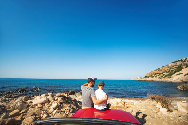istock Road trip. Father and son travelling together by ca 1312678068