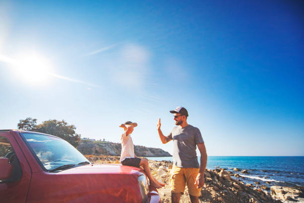 istock Road trip. Father and son travelling together by ca 1312678146