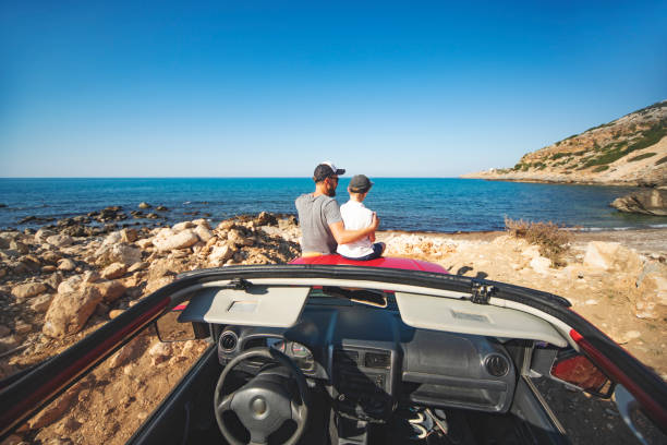 istock Road trip. Father and son travelling together by ca 1312678862