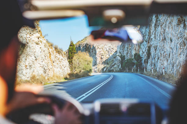 Road trip. Father and son travelling together by ca