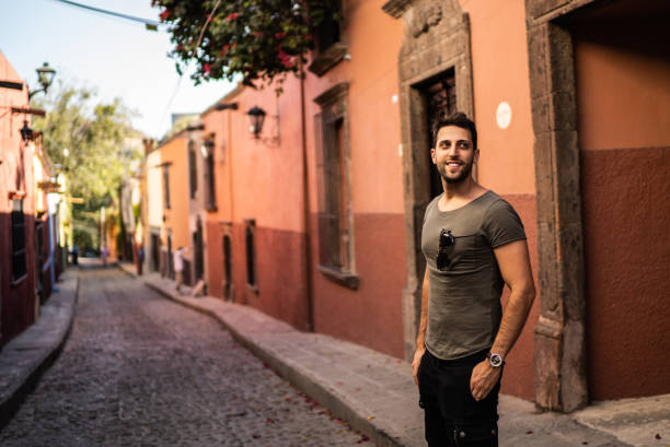 istock Man exploring city streets at Mexico 1312683625