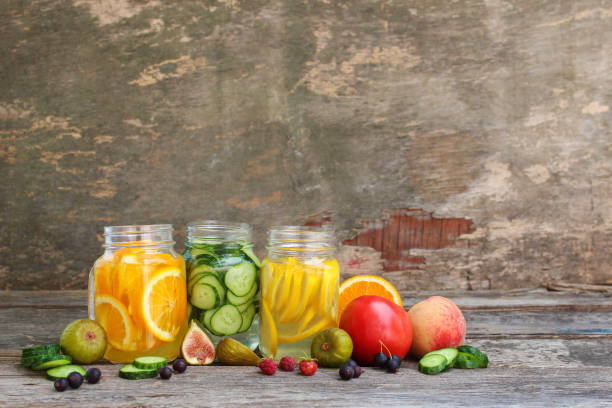 istock Different drinks, fruits and vegetables on wooden background. 1312684087