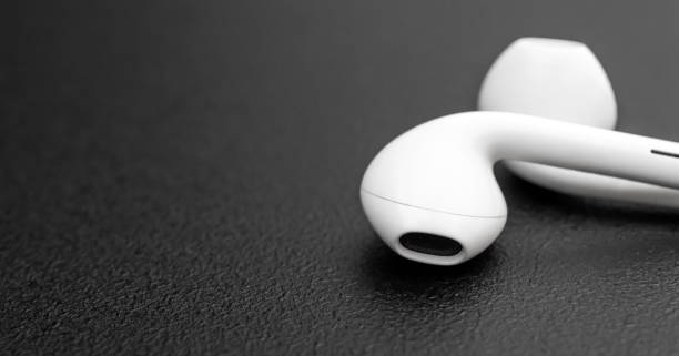 istock Small headphones on black background. Close up. Space for text. 1312684180