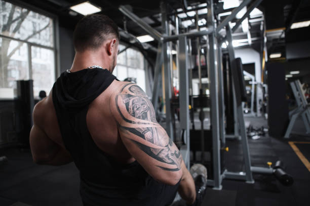istock Ripped bodybuilder exercising at the gym 1312684804