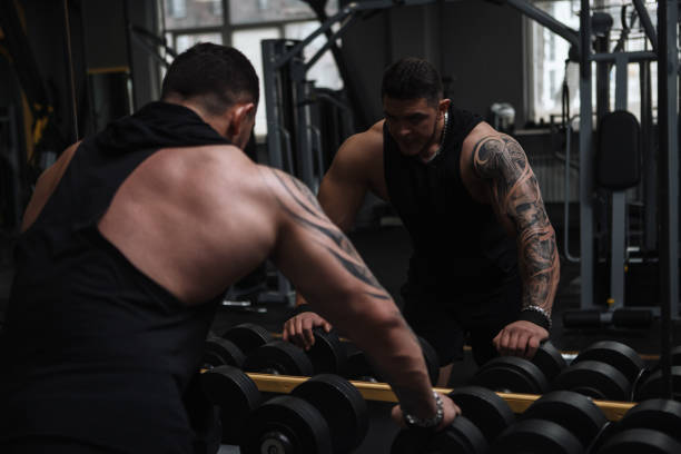 istock Ripped bodybuilder exercising at the gym 1312684849