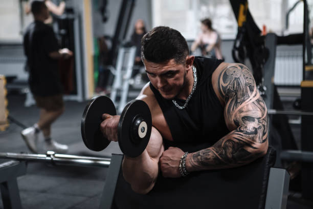 istock Ripped bodybuilder exercising at the gym 1312685036