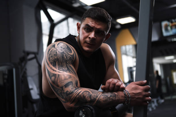 istock Ripped bodybuilder exercising at the gym 1312685064