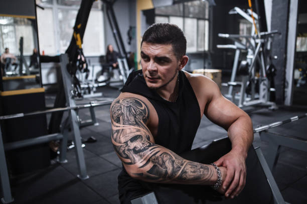 istock Ripped bodybuilder exercising at the gym 1312685073