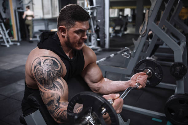 istock Ripped bodybuilder exercising at the gym 1312685098