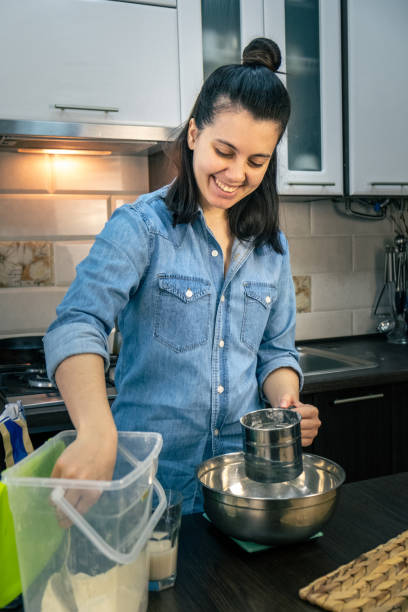 istock woman cooking with flour 1312685392