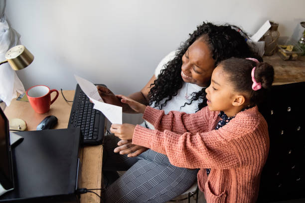 istock Woman working from home in small space with child around. 1312686351
