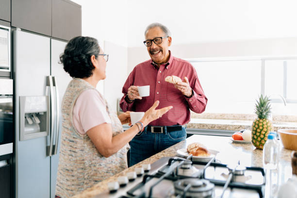 istock Senior couple preparing breakfast 1312686386
