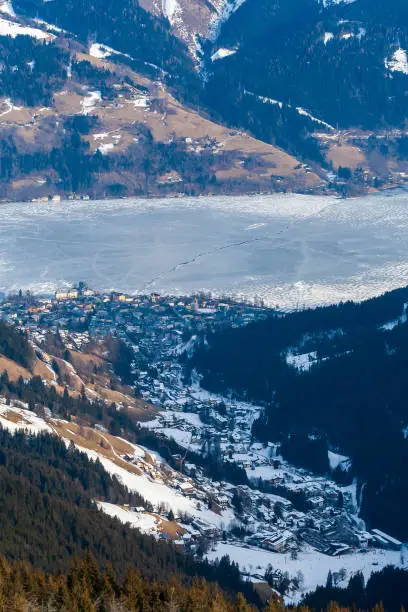 Top view of the snowy town and lake Zell am See in Austria.