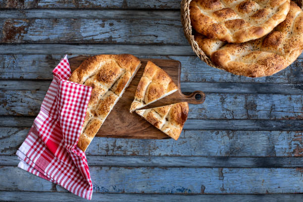 istock Ramadan pita bread on the table. Ramazan Pidesi 1312687739