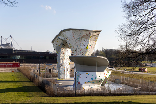 Munich, Germany - apr 8th 2021: Climbing wall near Munich Olympic Village attracts climbers to try their skills in outdoor climbing.