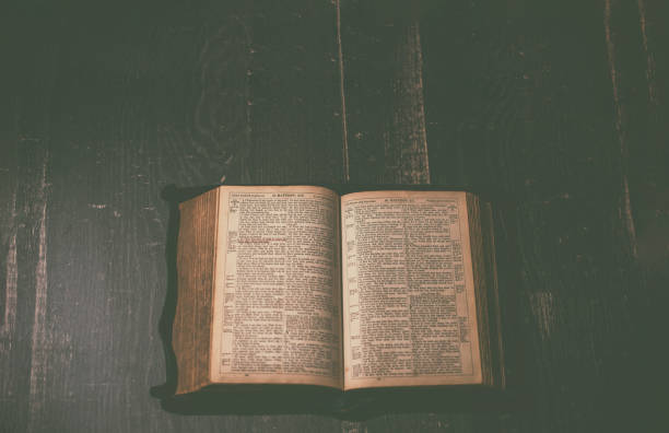 istock Top view of an old open Bible 1312690084
