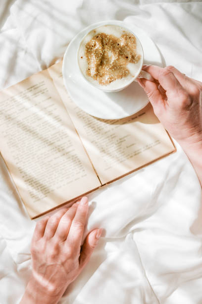 Bed, Coffee, Book and Leisure on Sunny Sunday Morning