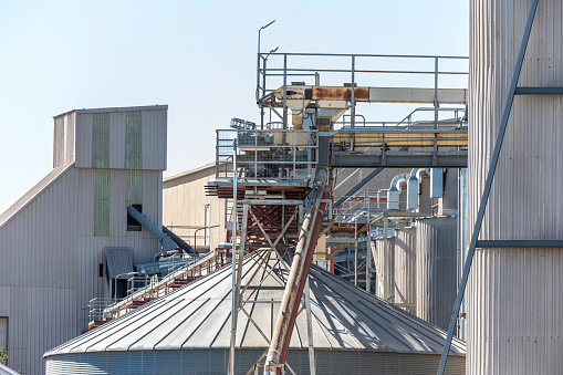 Production buildings and storage tanks and catwalk at a large flour mill