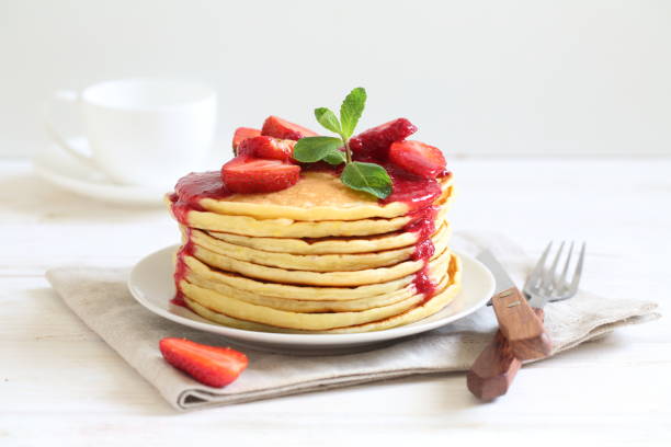 istock Pancakes with strawberries and mint 1312696463
