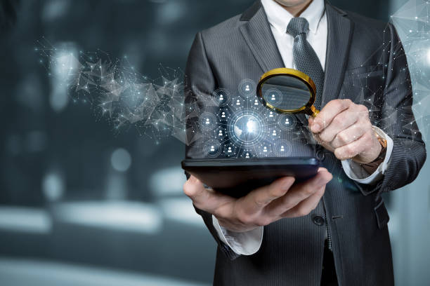 istock Businessman searches the global business network on a mobile device. 1312697809