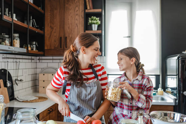 istock Having fun while preparing healthy meal with mother in the kitchen 1312698830