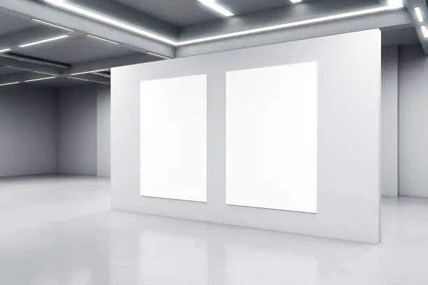 Empty big white room with a white concrete wall with two blank posters in the middle, artificially lighted, art gallery and exhibition interior design concept, 3d rendering, mockup