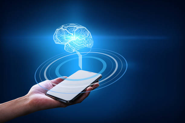istock Hand with a smartphone holding a brain hologram with circles on a dark blue background. Business idea and artificial intelligence concept 1312699657