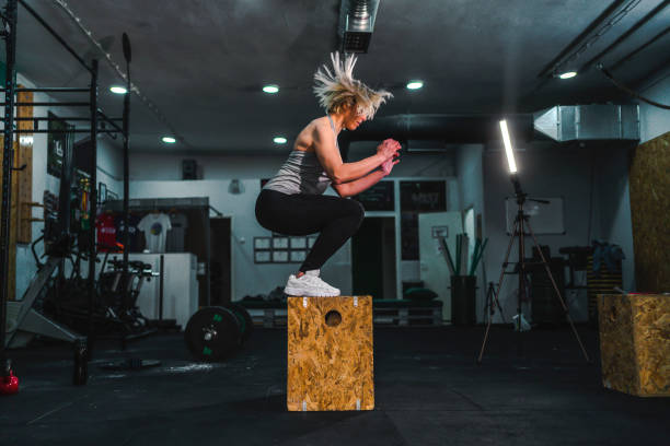 istock Sports woman doing box squat 1312699850